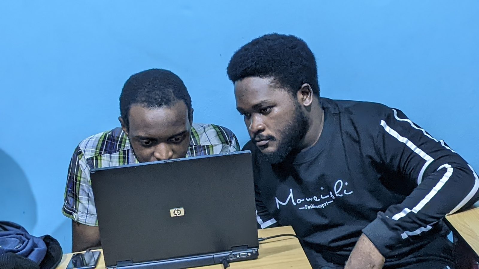 Boosted Technologies team working with laptops